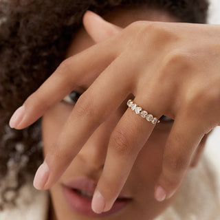 Dazzling heart bezel moissanite wedding band angled view showing its sparkle