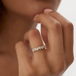 Sparkling heart bezel moissanite wedding band angled view showing its sparkle