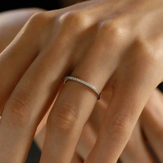Refined round half eternity moissanite wedding band front view