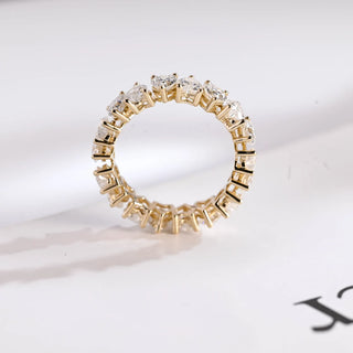 Stunning heart full eternity moissanite wedding band angled view showing its sparkle