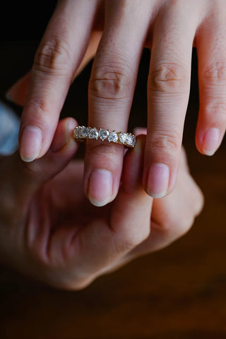 Stunning heart full eternity moissanite wedding band top view