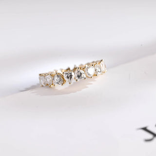 Stunning heart full eternity moissanite wedding band tilted view catching the light