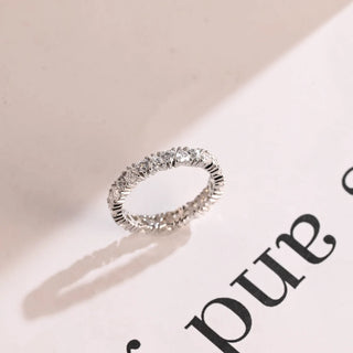 Graceful heart full eternity moissanite wedding band angled view showing its sparkle