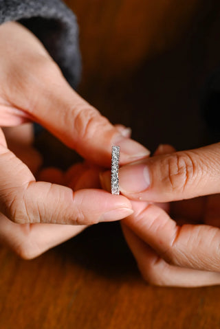 Graceful heart full eternity moissanite wedding band side profile view