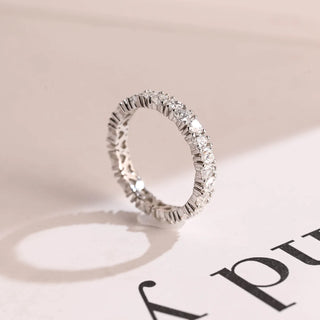 Graceful heart full eternity moissanite wedding band close up of the setting