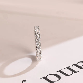 Graceful heart full eternity moissanite wedding band overhead view
