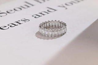 Delicate emerald full eternity moissanite wedding band side profile view