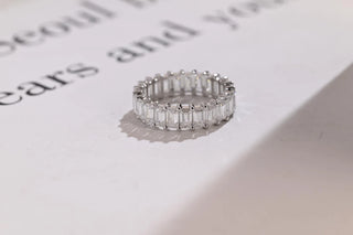 Delicate emerald full eternity moissanite wedding band front view