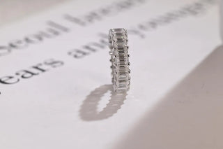 Delicate emerald full eternity moissanite wedding band top view