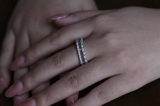 Delicate emerald full eternity moissanite wedding band sparkle close up