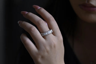 Delicate emerald full eternity moissanite wedding band overhead view