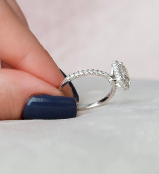 Chic 1.0ct emerald halo moissanite ring shown on a finger
