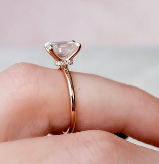 Shimmering 2.0ct emerald hidden halo moissanite ring side profile view
