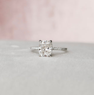 Gorgeous 2.50ct cushion hidden halo moissanite ring shown on a finger