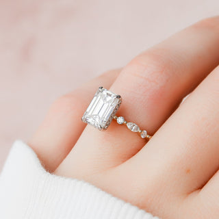 Modern 3.0ct emerald hidden halo moissanite ring shown on a finger