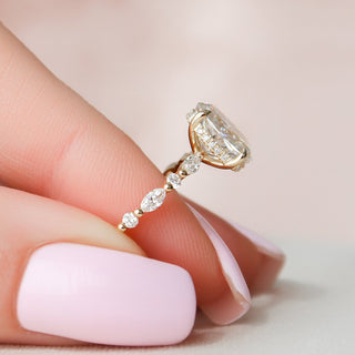 Graceful 2.0ct oval hidden halo moissanite ring shown on a finger