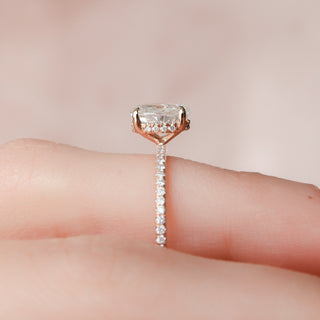 Gorgeous 1.0ct round hidden halo moissanite ring shown on a finger