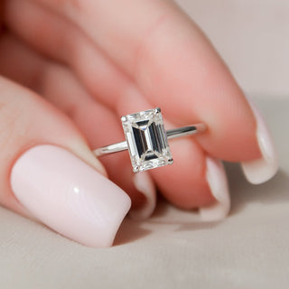 Gorgeous 2.0ct emerald hidden halo moissanite ring three quarter angled view