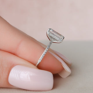 Refined 3.0ct emerald hidden halo moissanite ring shown on a finger