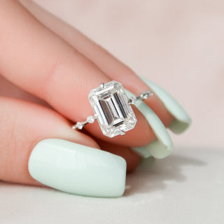 Sparkling 3.0ct emerald solitaire moissanite ring shown on a finger