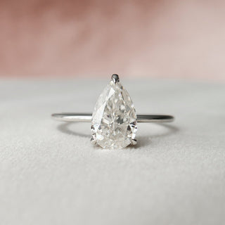Refined 2.0ct pear hidden halo moissanite ring overhead view