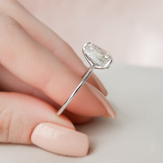 Sparkling 2.0ct pear hidden halo moissanite ring shown on a finger