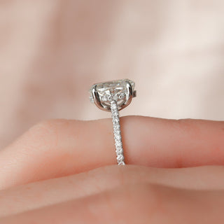 Radiant 2.0ct oval hidden halo moissanite ring shown on a finger