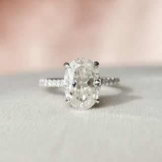 Graceful 2.0ct oval hidden halo moissanite ring overhead view