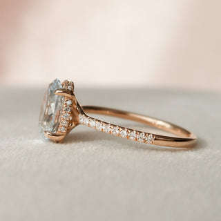 Luminous 2.0ct oval hidden halo moissanite ring shown on a finger