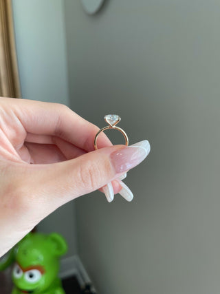 Luminous 2.0ct round solitaire moissanite ring side profile view