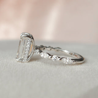 Modern 3.0ct emerald hidden halo moissanite ring tilted view catching the light