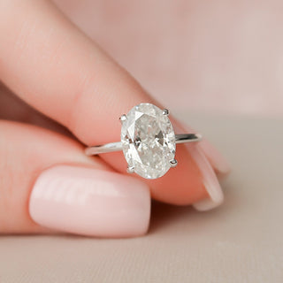 Exquisite 3.0ct oval hidden halo moissanite ring shown on a finger