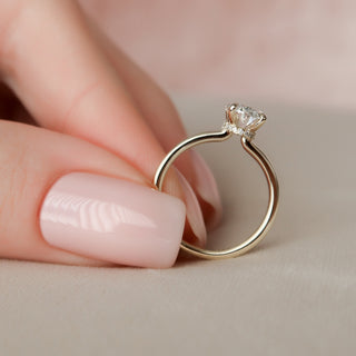 Brilliant 1.50ct oval hidden halo moissanite wedding band three quarter angled view