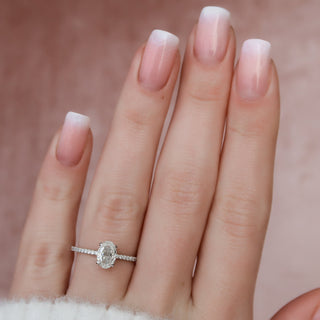 Gorgeous 1.0ct round hidden halo moissanite ring angled view showing its sparkle
