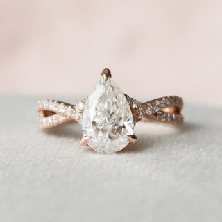 Delicate 1.0ct pear hidden halo moissanite ring top view