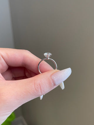 Shimmering 1.0ct round solitaire moissanite ring angled view showing its sparkle