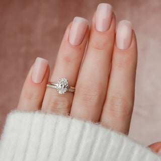 Brilliant 1.50ct oval hidden halo moissanite wedding band angled view showing its sparkle