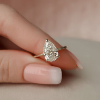 Brilliant 2.0ct pear hidden halo moissanite ring front view