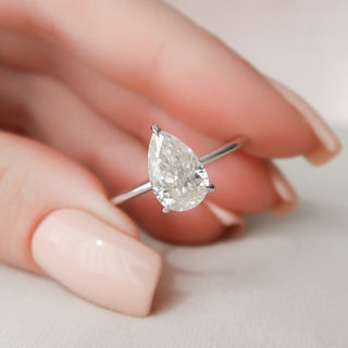 Brilliant 2.0ct pear hidden halo moissanite ring detail view of the band