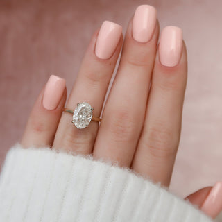 Delicate 3.0ct oval hidden halo moissanite ring angled view showing its sparkle