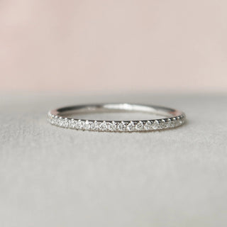Elegant 1.0ct radiant hidden halo moissanite wedding band three quarter angled view