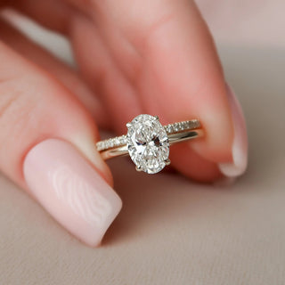 Brilliant 1.50ct oval hidden halo moissanite wedding band front view