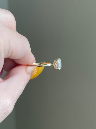 Refined 2.0ct oval solitaire moissanite ring close up of the setting