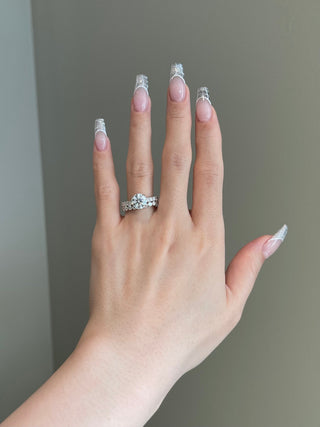 Sparkling 2.0ct round hidden halo moissanite ring angled view showing its sparkle