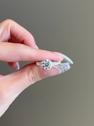 Shimmering 2.0ct round hidden halo moissanite ring front view