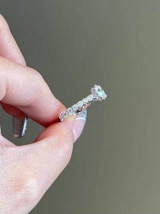 Sparkling 2.0ct round hidden halo moissanite ring side profile view