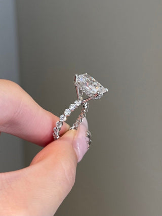 Gorgeous 5.0ct radiant hidden halo moissanite ring shown on a finger