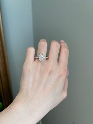 Luminous 3.0ct oval hidden halo moissanite ring angled view showing its sparkle