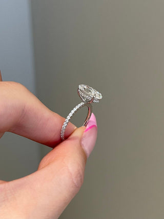Luminous 3.0ct oval hidden halo moissanite ring shown on a finger