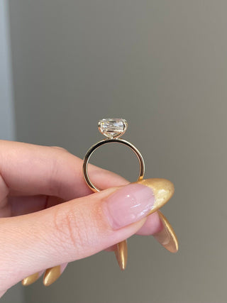 Elegant 3.0ct cushion solitaire moissanite ring angled view showing its sparkle